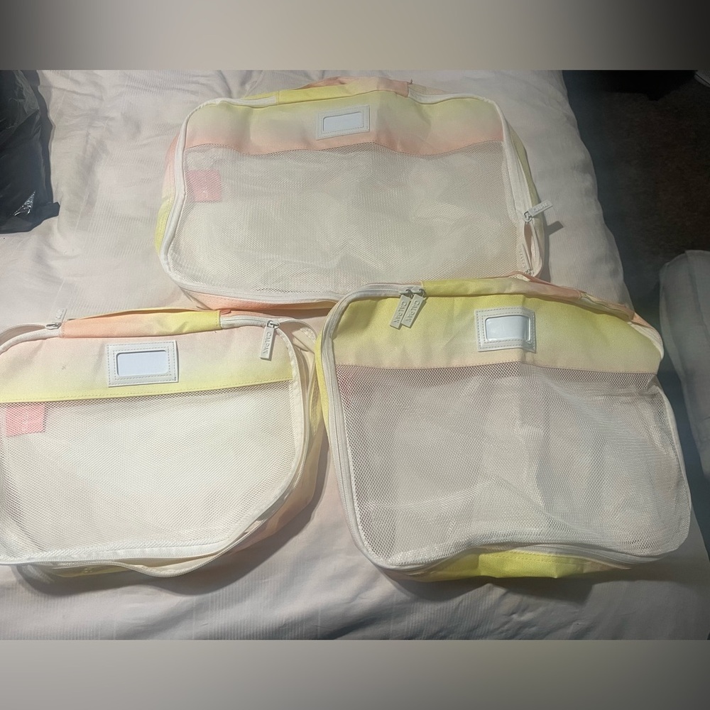 Calpak Yellow and Pink Travel Organizers